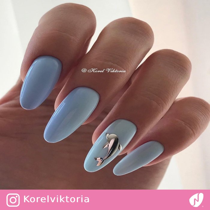 Light Blue Nails with a Silver Chrome Dolphin